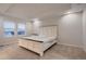 Spacious bedroom with neutral decor, large window, and tray ceiling provides ample natural light at 17203 Birds Foot Ave, Parker, CO 80134