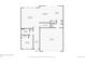 First floor plan featuring a living room, dining room, kitchen, and garage at 17203 Birds Foot Ave, Parker, CO 80134