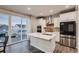 Bright kitchen with stainless steel appliances, an island, adjacent dining area and access to the backyard deck at 17203 Birds Foot Ave, Parker, CO 80134