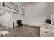 Spacious living room featuring wood floors, a large sectional, high ceilings and a loft area at 17203 Birds Foot Ave, Parker, CO 80134