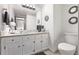 Bathroom featuring modern fixtures, a vanity with storage, and a clean, contemporary design at 1324 Shadow Mountain Dr, Highlands Ranch, CO 80126