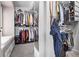 Organized walk-in closet with shelving, hanging space, and ample storage solutions at 1324 Shadow Mountain Dr, Highlands Ranch, CO 80126