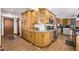 Spacious kitchen offering wood cabinetry, modern appliances, and plenty of storage space at 1324 Shadow Mountain Dr, Highlands Ranch, CO 80126