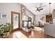 Inviting living area with a stone fireplace, warm lighting, and comfortable seating at 1324 Shadow Mountain Dr, Highlands Ranch, CO 80126