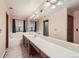 Bathroom with double vanity and a bathtub at 11275 Ranch Pl, Denver, CO 80234