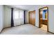 Small bedroom with closet and access to bathroom at 11275 Ranch Pl, Denver, CO 80234