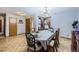 Dining room with parquet flooring and a wood table with chairs at 11275 Ranch Pl, Denver, CO 80234