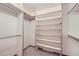 Large walk-in closet with shelves and hanging rods at 11275 Ranch Pl, Denver, CO 80234