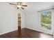 Bedroom showcasing hardwood floors, a window, and an open closet for optimal storage and lighting at 8060 Niwot Rd # 38, Niwot, CO 80503