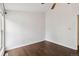 Spacious bedroom boasts wood floors, white walls, and a window for ample natural light at 8060 Niwot Rd # 38, Niwot, CO 80503