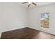 Bedroom featuring hardwood floors, a window that provides natural light, and white walls at 8060 Niwot Rd # 38, Niwot, CO 80503