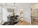 Dining room with modern table, view to bathroom and kitchen, and unique rug at 8060 Niwot Rd # 38, Niwot, CO 80503