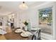 Dining room with a view to fireplace, stairs, and parking area at 8060 Niwot Rd # 38, Niwot, CO 80503
