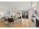 Bright living room featuring modern decor, hardwood floors, and sliding glass doors to a balcony at 8060 Niwot Rd # 38, Niwot, CO 80503