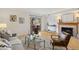 Inviting living room with fireplace, wood floors, and a walkout to balcony at 8060 Niwot Rd # 38, Niwot, CO 80503