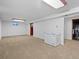 Unfinished basement with carpet, a freezer, and good storage space at 28735 Little Big Horn Dr, Evergreen, CO 80439