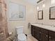 Updated bathroom with double vanity and plenty of storage at 28735 Little Big Horn Dr, Evergreen, CO 80439