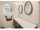 Bathroom with double sinks and updated fixtures at 28735 Little Big Horn Dr, Evergreen, CO 80439