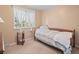 Small bedroom with a twin bed, window, and ample natural light at 28735 Little Big Horn Dr, Evergreen, CO 80439