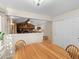 Bright dining area with view of living room and fireplace at 28735 Little Big Horn Dr, Evergreen, CO 80439