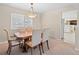 Bright dining room with wood table and seating for six at 28735 Little Big Horn Dr, Evergreen, CO 80439