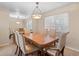 Elegant dining room with wood table and six chairs at 28735 Little Big Horn Dr, Evergreen, CO 80439