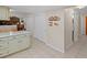 Hallway featuring tile floors, closet space, and seamless transition into living area at 28735 Little Big Horn Dr, Evergreen, CO 80439