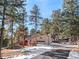 Two-story house exterior with driveway and attached garage at 28735 Little Big Horn Dr, Evergreen, CO 80439