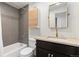 Modern bathroom with dark vanity and updated fixtures at 1217 E 26Th Ave, Denver, CO 80205