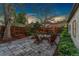 Backyard area featuring an inviting fire pit and beautiful stone patio offering a perfect outdoor gathering space at 1376 S Clayton St, Denver, CO 80210