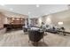 Finished basement offers a spacious living area, brick-clad bar, and comfortable seating for entertaining at 1376 S Clayton St, Denver, CO 80210