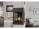 Beautiful bathroom featuring a modern fireplace, soaking tub, and stylish decor at 1376 S Clayton St, Denver, CO 80210