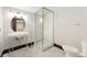 Bathroom features a glass shower and a stylish pedestal sink creating a clean, modern space at 1376 S Clayton St, Denver, CO 80210