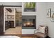 Luxurious bathroom boasts an inviting fireplace, sleek vanities, and a modern glass shower at 1376 S Clayton St, Denver, CO 80210