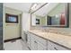 Well-lit bathroom features a granite vanity, large mirror, and ample storage space at 1376 S Clayton St, Denver, CO 80210