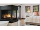 Bedroom and fireplace area including a bed and dark wood trim and large glass doors at 1376 S Clayton St, Denver, CO 80210