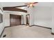 Bright bedroom with beamed ceiling, closet, and ladder at 1376 S Clayton St, Denver, CO 80210