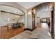 View of the foyer featuring a stone tile entry and arched doorway leading to the dining room at 1376 S Clayton St, Denver, CO 80210