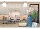 Bright kitchen featuring a granite countertop island, stainless steel appliances, and ample cabinet space at 1376 S Clayton St, Denver, CO 80210
