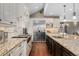 Bright, updated kitchen with granite countertops, stainless steel appliances, and hardwood floors at 1376 S Clayton St, Denver, CO 80210