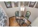Staircase with metal banister, wood steps, chandelier, and numerous windows providing ample natural light at 1376 S Clayton St, Denver, CO 80210