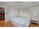 Bedroom with hardwood floors, neutral walls, and red laundry at 1149 Columbine St # 104, Denver, CO 80206