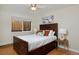 Bedroom with hardwood floors and a rustic bed frame at 1149 Columbine St # 104, Denver, CO 80206