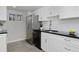 White cabinets, stainless steel appliances and dark countertops in kitchen at 1149 Columbine St # 104, Denver, CO 80206