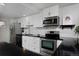 Modern kitchen with stainless steel appliances and white cabinetry at 1149 Columbine St # 104, Denver, CO 80206