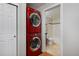 Stackable red washer and dryer with bathroom access at 1149 Columbine St # 104, Denver, CO 80206