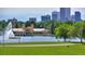 Lake view with pavilion and city skyline in background at 1149 Columbine St # 104, Denver, CO 80206