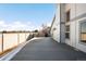 Deck overlooks fenced backyard and distant mountains at 9053 W 103Rd Ave, Broomfield, CO 80021