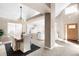 Spacious dining room with hardwood floors and a view of the living room at 9053 W 103Rd Ave, Broomfield, CO 80021