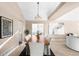 Bright dining area featuring a wood table and stylish wall art at 9053 W 103Rd Ave, Broomfield, CO 80021